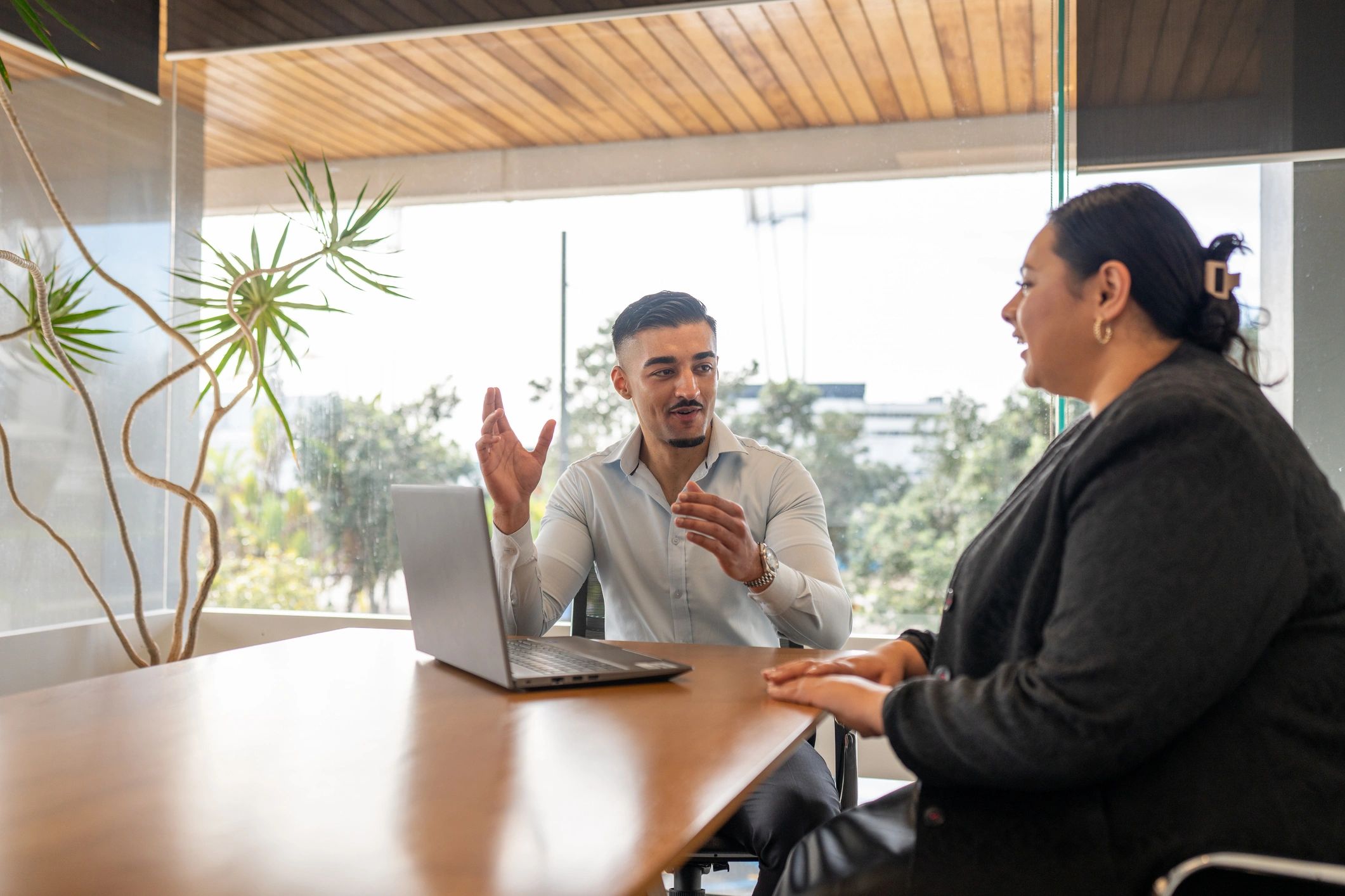 Consultant advising a client in an office setting